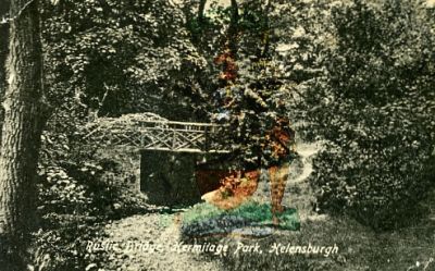 Rustic Bridge
The rustic bridge was in Hermitage Park. If you could see through the trees you would see the Victoria Halls. Hermitage Primary School is off to the left. Date unknown.
