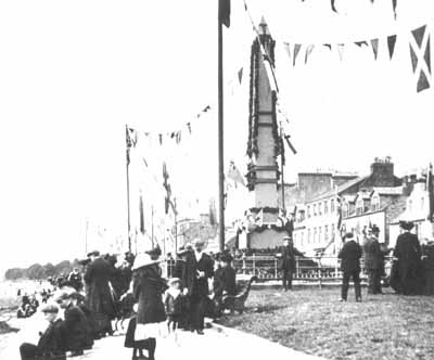 Seafront Celebration
The Henry Bell Monument is decorated with bunting as townfolk celebrate the centenary of Henry Bell's steamship Comet in 1912.
