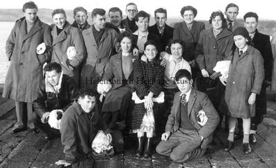 1953 Ne'erday Swim
The Ne'erday swimmers on Helensburgh pier on January 1 1953. Back: Burns, McCrea, Wright, McDonagh, Boyle, Milne, Hailstones, Bilsland, McHardy, McHardy, Sanders, Marsland; middle: Bird, Finnighan, McDonagh, Burgess, McDonagh; front: Cravens, Wright. Image supplied by Jenny Sanders.
