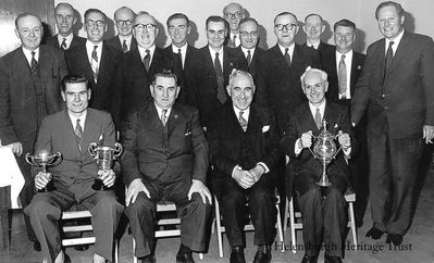 Hermitage winners
The Hermitage Bowling Club prizewinners at their annual presentation of prizes in the Kingsclere Hotel, predecessor of the Commodore Hotel, in the early 1960s. Among those in the front row are John Sharp (left), Provost J.McLeod Williamson (2nd right) and Bert Burtles. Among those standing are Willie Ralph, Tom Lillburn and Tom Boyle. Image supplied by Jim Lillburn.
