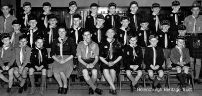 1st Cardross Cub Pack c.1947/8
Back row (from left): ?, Andrew Thomson, Martin Carrie, Bruce Kelly, Willie McSporran, Donald Maclean, John Sofio, Neil Campbell, Donald McSporran; middle row: ?, Hugh Davie, Bobby Brown, Alec Davie, Ian McLeod, Jimmy MacDonald, Robert Paterson, Bill Clow, Freddy Ashman; front: Jim McPherson, Neil Shaw, Duncan Bulloch, Elspeth MacArthur?, Archie Mills, May Campbell, Andrew Mackie, Walter Ashman, Donald McNair. Missing names would be welcomed. Image supplied by Donald Maclean.
