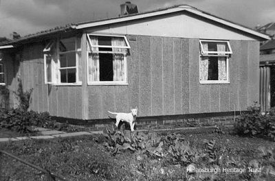 Burgh prefab
The town had a number of prefab homes for several decades, and this one is 2 The Triangle, just behind the Victoria Infirmary and where Johnston Court is now. Image, date unknown, supplied by Helensburgh Memories member Paul Oakes.
