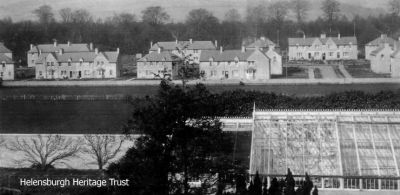 Ardencaple Quadrant
Ardencaple Quadrant, built originally to house those who had been injured in the First World War, seen beyond the greenhouse of Ferniegair which was demolished in the 1960s. Image date unknown.
