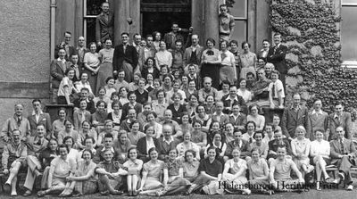 Methodist holiday
A group of Methodists of all ages on holiday at Ardenconnel House in Rhu in the mid-1930s. The B-listed mansion was built by the Buchanan family in the late 18th century, and Ardenconnel was one of the principal estates of the old parish of Row. It was bought in 1899 by the Countrywide Holidays Association, and by 1908 could accommodate 120 guests. The CHA is the oldest walking holiday company in the country, set up in 1893 to encourage participation in, and enjoyment of, the countryside, and to this day, while no longer operating walking holidays, is still working hard to fulfil the vision of founder the Rev T.A.Leonard. The mansion was later converted into modern flats. Image by Jean M.Watson.
