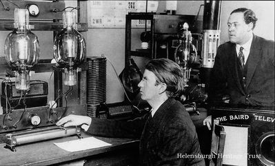 Television transmitter
John Logie Baird at the transmitter of his experimental radio station G2KZ from which television was transmitted across the Atlantic in February 1928. Looking on is his technical assistant, Ben Clapp.
