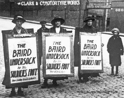 Selling Baird undersocks
One of John Logie Baird's inventions was the Baird undersock, described as a specially medicated soft absorbent sheath worn next to the skin under the sock to absorb and neutralise perspiration, keeping feet clean and healthy. Said to be ideal for the soldier, and with tributes from men in the World War One trenches, they cost eight shillings for half a dozen pairs. Image date not known.
