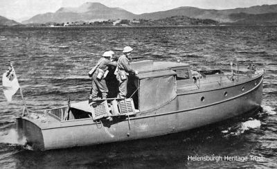 The Balloch Navy
World War Two Home Guard security extended around Loch Lomond, where the Rhu-based Marine Aircraft Experimental Establishment conducted top secret trials, but this was not the responsibility of MAEE. The fear was that German seaplanes might land on Loch Lomond, especially at night, so the â€˜Balloch Navyâ€™ patrolled the loch in requisitioned motorboats which were armed and flew the white ensign. Image by courtesy of Iain McAllister from the Silver Motor Yachts private Facebook group.
Keywords: Balloch navy