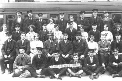 Railway Staff
Staff at Helensburgh Central Station in 1928. Back row from left: Dan Feeney, â€” , â€” , Lizzie Robertson, George Taylor, Mrs Sarah Shields, Sam McKinlay, Willie Wilkie, â€” . Third: Jean Wallace, Dennis Shields, Bessie McDonach, â€” , Sarah McDonald, Alexander Paterson, Julia O'Brien, Pat Boyce, Miss Robb, John Rafferty. Second: Norman McLeod, John McConnell, Mrs Lorimer, â€” , stationmaster and local councillor George Stevenson, â€” , â€” , Sandy Chapman, â€” . Front: Willie Busby, Duncan McInnes, Harry Stevenson, Pat Coleman, Willie Ritchie, Joe Kennan.
