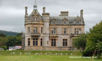 Cairndhu
The magnificent William Leiper-designed Helensburgh seafront mansion Cairndhu, which is now boarded up, pictured in its heyday by Gordon Fraser. It was built for Glasgow businessman John Ure, who later became Lord Provost of Glasgow, in the style of a miniature French chateau, with stained glass windows by Daniel Cottier. The mansion remained a private home until the Second World War. In September 1940 it was requisitioned by the Royal Navy and became home to part of HMS Vernon, along with neighbouring Ardencaple Castle. for degaussing operations. In 1947 Cairndhu was returned to private ownership and became a hotel and then a nursing home.
