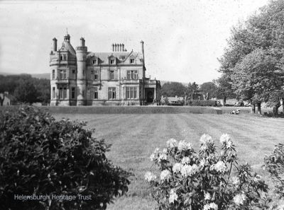 Cairndhu House
Cairndhu on Helensburgh seafront when it was a family home. Later it became the Cairndhu Hotel, then a nursing home for the elderly, and it is now disused. Originally Cairndhu House, it was built in 1871 to a William Leiper design in the style of a grand chateau for John Ure, Provost of Glasgow, whose son became Lord Strathclyde and lived in the mansion. Image, date unknown, supplied by Mrs Sheila Allan.
