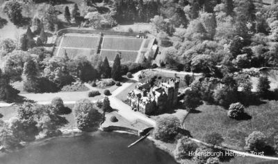 Cameron House
An aerial view of Cameron House on Loch Lomondside, near Alexandria, before it became a luxury hotel. It was the family home of Patrick Telfer Smollett and his wife Gina, surrounded by 25 acres of gardens which for some years he operated as a Bear Park before he sold the property in 1986. The 18th century baronial mansion â€” for a time the home of 18th century novelist and poet Tobias Smollett â€” was steeped in Scottish history, and contained many unique and unusual collections. For three centuries, the Cameron House estate remained in the hands of the Smollett family, originally merchants and shipbuilders from Dumbarton and later wealthy landed gentry. Image date unknown.
