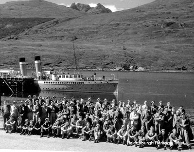 A previously unpublished picture from a fighter pilot's scrapbook of members of the RAF's 610 Squadron on summer visit to Arrochar from their base in Cheshire in 1938. In the background is a steamer at the now demolished Arrochar Pier, and the summit of the Cobbler mountain. The following year war broke out and two years later these men were fighting in the Battle of Britain and Helensburgh had its own RAF station. Image supplied by Robin Bird.
