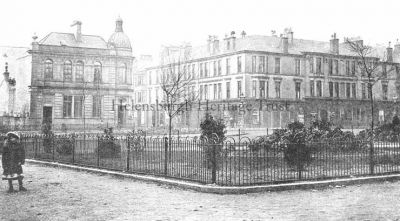 Colquhoun Square
A view across Colquhoun Square from the south east quadrant, with a young girl on the left, two men sitting on the roof of the building behind the Post Office, and a worker up a ladder cleaning a window of the Post Office building. Image date unknown.
