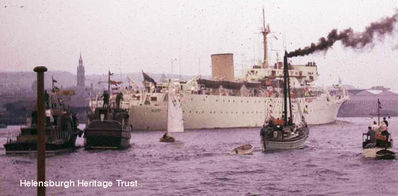 Comet replica 1962
The Comet replica, built by apprentices at William Lithgow at Port Glasgow for the 150th anniversary of the first sailing of Henry Bell's Comet, Europe's first commercial steamship, is seen steaming down river past a cruise liner. To mark the anniversary, the replica sailed from Port Glasgow to Helensburgh, with civic dignitaries on board in costume for 1812. Image taken and supplied by Jim Bamber.
