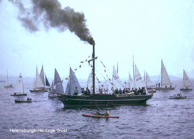 Comet replica 1962
The Comet replica, built by apprentices at William Lithgow at Port Glasgow for the 150th anniversary of the first sailing of Henry Bell's Comet, Europe's first commercial steamship, is seen steaming across the Clyde accompanied by a fleet of yachts. To mark the anniversary, the replica sailed from Port Glasgow to Helensburgh, with civic dignitaries on board in costume for 1812. Image taken and supplied by Jim Bamber.
