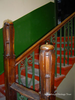 Conservative Club
The upstairs premises at 40 Sinclair Street, Helensburgh, housed the Conservative and Unionist Club Rooms. The attractive building was designed in 1894 by Honeyman and Keppie, and it is thought Charles Rennie Mackintosh, then a young architect employed by the firm, contributed to the design which has many Glasgow-style features. A statue of St Andrew, the crest of the club, occupies a niche in a central position on the facade. Now the building is owned by the clothing firm Mackays. Image by Stewart Noble.
