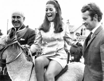 Lions Carnival
Miss Great Britain, Jennifer Gurley, is with Helensburgh Lions Club members Provost J.McLeod Williamson and Alan Wylie at the Lions Club's Carnival and Donkey Derby in East King Street Park in July 1968. In the background is another Lions Club member, Stewart Walker.
