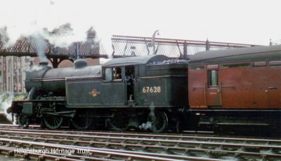 Engine number 67628, an 84 ton Gresley-designed V1 class 2-6-2T locomotive prepares to leave Helensburgh Central Station. The photo was taken some time between 1956 and 1959 when electric train services were introduced.
