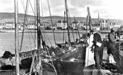 Fishing boats
Fishing boats tied up at Helensburgh pier. Image circa 1942.
