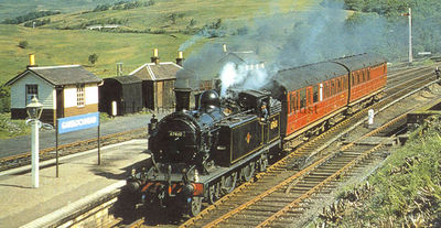 Train at Garelochhead
A steam train passes through Garelochhead Station. The engine no.67460 is a Class C15 push-and-pull, a class designed by Reid and introduced in 1911, weighing some 68 tons. Image date unknown.
