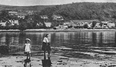 Garelochhead East
Two children paddle in the Gareloch, with east Garelochhead beyond. Image circa 1919.
