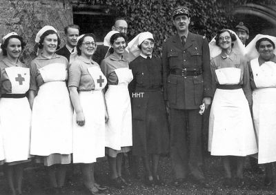 De Gaulle at Cove
Free French leader General Charles De Gaulle, later to become President of France, visited Free French naval wounded at the World War Two Knockderry Hospital in Cove â€” in the requisitioned Knockderry Castle â€” on Christmas Eve 1942. Having arrived with his aides by taxi from Kilcreggan Pier, driven by local man Tom McNeilage, he spent an hour with the patients and distributed gifts. The Secretary of State for Scotland would have attended to welcome him, but did not have enough notice of the visit. Photo by James Hall of Greenock, which is in the Norman Burniston Collection, published by kind permission of Norman Burniston.
