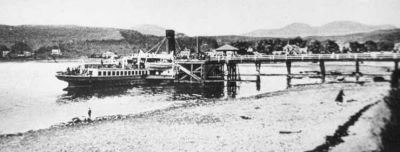 Steamer at Garelochhead Pier
A steamer is berthed at the pier at Garelochhead, probably the Lucy Ashton which called regularly from 1906 until the pier closed in 1939. Image circa 1905.
