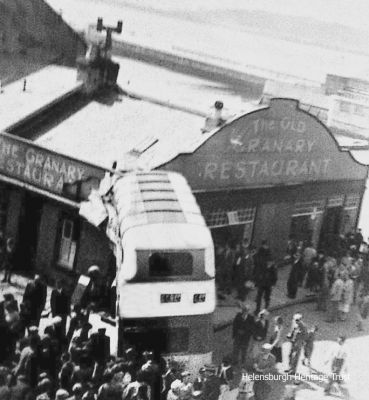 Granary bus crash
A Garelochhead Coach Services bus crashed into the Granary Restaurant on West Clyde Street after careering down Sinclair Street when the brakes failed. The driver of a Saturday bus from Luss elected to hit the building rather than land on the shore, and was widely praised for his skill in avoiding pedestrians. No-one was seriously injured. Image c.1958 supplied by Robbie Don.
