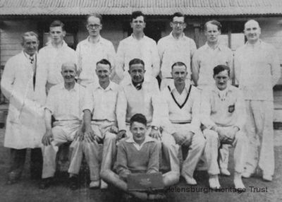 Helensburgh 1st XI 1953
The Helensburgh Cricket Club 1st XI of 1953 line up for the camera in front of the old pavilion at Ardencaple, which was burnt down some years later. Standing (from left): umpire J.McFarlane, J.Keir, J.P.Kinloch, Ian Gilchrist, Willie Gilchrist, R.A.Whitton, J.A.N.Withrington. Seated: G.Johnstone, J.Blain, captain J.M.Ramsay, Bill Nicholson, J.H.F.Morton. In front is scorer Robert Lindsay. The photo was taken by well known local photographer Bill Benzie.
