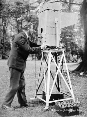 Noctovision
A 1929 image of TV inventor John Logie Baird working on another of his inventions, Noctovision, a night vision device, on Boxhill in Surrey. It was slung on gimbals and rotated about a circular compass scale, and was said to be able to pick up a ship's lights in fog and give a compass bearing, or televise people who were in complete darkness.
