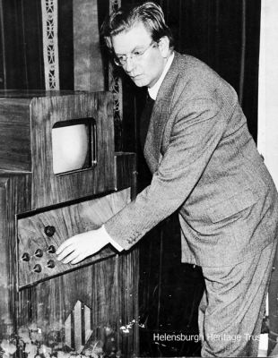 Baird receiver
John Logie Baird is pictured with a C.R.T. receiver, circa 1935.
