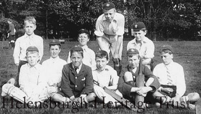 Argyll Street Cricket Club
This is a photo of Larchfield School pupils taken by John Logie Baird in about 1900 at the Larchfield cricket field near the Duchess Wood at Ardencaple. His friend Jack Buchanan, later to become a famous entertainer, is seated on the right with his cap at a rakish angle. Professor Malcolm Baird, who kindly supplied the image, says: â€œThere are ten people in the group, and it is possible that JLB was the 11th member of the team! There is nothing more on record."   
