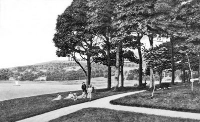 Kidston Park
A family relax at Kidston Park, circa 1910. Bought from the Duke of Argyll in 1877 for Â£650 by William Kidston with help from Sir James Colquhoun and others, the area was formerly Cairndhu Point â€” known locally as Neddy's Point after a well known fisherman and ferryman who lived nearby â€” but was renamed Kidston Park from 1889 when Mr Kidston left money to support its maintenance and requested the name change.
