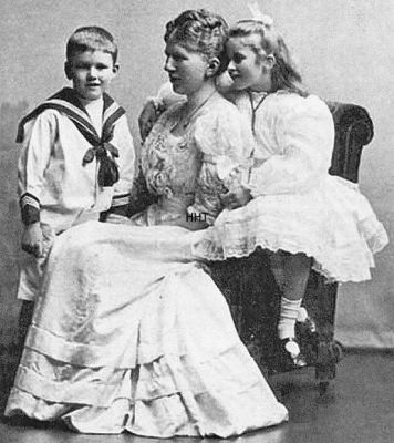 Maggie Hamilton and her children
Noted artist Maggie Hamilton (1867-1952) was the daughter of James and Mary Hamilton, of Thornton Lodge, Sinclair Street, Helensburgh, and brother of artist J.Whitelaw Hamilton, one of the first of the 'Glasgow Boys'. In 1897 she married architect and artist Alexander Nisbet Paterson, and she is seen here with their children Alistair and Viola inside their family home, Long Croft, in West Rossdhu Drive. Image by courtesy of the Anderson Trust.
