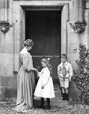 Maggie Hamilton
Noted artist Maggie Hamilton (1867-1952) was the daughter of James and Mary Hamilton, of Thornton Lodge, Sinclair Street, Helensburgh, and brother of artist J.Whitelaw Hamilton, one of the first of the 'Glasgow Boys'. In 1897 she married architect and artist Alexander Nisbet Paterson, and she is seen here with their children Alistair and Viola outside their family home, Long Croft, in West Rossdhu Drive. Image by courtesy of the Anderson Trust.
