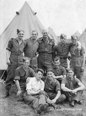 Territorials at camp
Argyll and Sutherland Highlanders Territorials from Helensburgh relaxing at a camp in the late 1930s. Lachie McDonald is second from left back row, while Jimmy Handyside is on the right in the back row. The surname of the man at the left end of the front row is believed to be MacFarlane. Image supplied by Mrs Betty Stewart.
