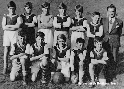 Arrochar champions
The Arrochar Primary School football team of 1955 who won the Lochside League, a competition for village primary school teams in Helensburgh District but outwith Helensburgh. The line-up is â€” back row from left: Joey Atkinson, Ian McLean, Freddie Mathieson, Timber Woods, Dougie McGilvary, Johnnie McEachern; front: Sandy McPherson, Willie McDonald, Donald McLeod, Bruce Sutherland, Donald McGlone. The adult is schools attendance officer Donnie Thomson, who was also associated with Rhu Amateurs for many years. Image supplied by Stella Trainor, Ontario, Canada.
