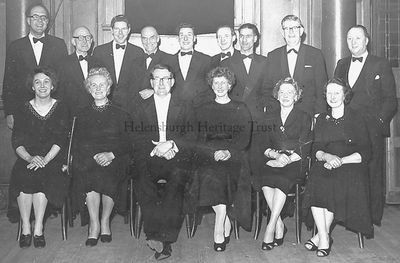 Helensburgh Amateur Operatic Society
Members of Helensburgh Amateur Operatic Society before a performance in the Victoria Hall in the late 1950s-early 1960s. Front (from left): celloist Rosemary Gillies, Mrs Erskine, conductor Arthur Brocklebank, violinist Mary Gray, violinist Mrs R.Paterson, pianist Doris Bryden; standing: unknown professional drummer, trumpeter Frank O'Donnell, unknown, unknown, bass Robert McLaren, clarinet/sax Johnny Campbell, Peter Reece, unknown, Mr Erskine. Image supplied by Lorraine Cavana.
