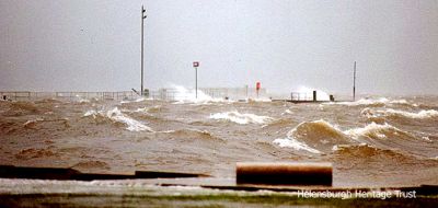 Pier awash
Helensburgh pier is underwater during a storm in January 1999. Photo kindly supplied by Iain Duncan.
