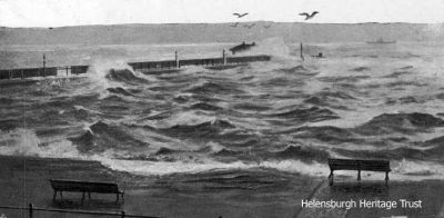 Pier awash
Helensburgh pier is almost submerged in a gale. Image circa 1928.

