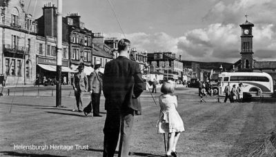 Sunny putting
A bus awaits at Helensburgh pierhead and the putting green is busy on a sunny afternoon. Image c.1966.
