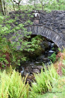 Ram's Head Bridge
This 2012 photo by Donald Fullarton shows the Ram's Head Bridge in Glen Luss, built in 1777 by William Johns, seen in winter with little vegetation. It was also known as the Tupp Bridge. Glen Luss was one of the first of the Highland glens to be cleared after the defeat of the Jacobites in 1745, with the people forced off the land and replaced by the Linton breed of black-faced sheep.
