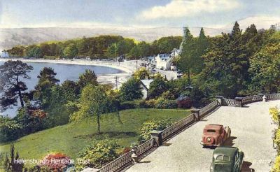 Looking down on Rhu
Rhu village and Rhu Bay are seen from above from the drive of Woodstone Court, circa 1959. A black and white version is also in this album.
