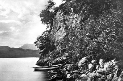 Rob Roy's Cave
The entrance to Rob Roy's Cave on Loch Lomond, circa 1915. It is sited on the east bank near Inversnaid and was not so much a cave as a shelter provided by the fallen rocks. It is thought to have provided shelter for both Rob Roy and Robert the Bruce â€” the latter is said to have been saved from his pursuers when sleeping wild goats in front of the cave misled his enemies into believing it was empty. Rob Roy was for a time Laird of Craigrostan and Inversnaid.
