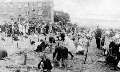 Sandcastle competition
Competitors rush to complete their entries in a sandcastle building competition on Helensburgh's east seafront. Image, date unknown, supplied by Sue Taylor.
