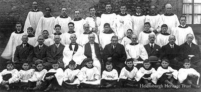 St Michael's Church dedication of tower and bells 1930
Back: C.Sinclair Smith, P.Reece, G.H.Stanton, W.Taylor, H.Taylor, G.Rodger, J.Swankie, P.Reece Jnr., A.Reece, J.Ingram; 2nd: G.R.Stocks, G.Robertson, A.Newton, ?, G.Robertson, R.Stanton, A.Paterson, D.Stark, G.Malcolm, A.Paterson, R.Lees. Seated: Capt Watson, Dr R.Fullarton, A.Wedgwood, Canon Beard, Bishop Reid, Sir William Raeburn, organist E.W.Hardy, Provost J.F.Duncan, N.Peck, J.F.Henderson. Front: W.Breheny, P.Peacock, ?, S.Myles, J.Trimmer, A.Donnachie, J.Walker, H.Johnston, G.Horn, R.Paterson.
