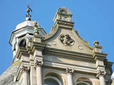 Cairndhu carving
A cafrving high on the wall of the former Cairndhu Hotel, later a nursing home for the elderly and now disused and boarded up. Originally Cairndhu House, it was built in 1871 to a William Leiper design in the style of a grand chateau for John Ure, Provost of Glasgow, whose son became Lord Strathclyde and lived in the mansion. 2011 image by Stewart Noble.
