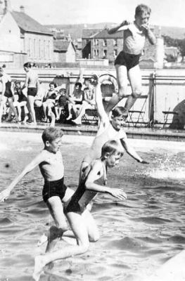 Taking the plunge
Four young swimmers jump into the Helensburgh outdoor pool in the 1930s.
