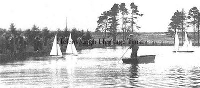 Skating and sailing pond
Model yacht enthusiasts sail their models in the skating pond at the top of Sinclair Street in 1949, watched by many spectators.
