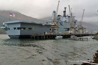 Ark Royal's Farewell
The 25 year-old aircraft carrier HMS Ark Royal, the Royal Navy flagship, is pictured during four days moored at the Glenmallon jetty in Loch Long for her ammunition to be removed, following the Government decision to decommission the 22,000 ton vessel. Image supplied by Fiona Holland.
